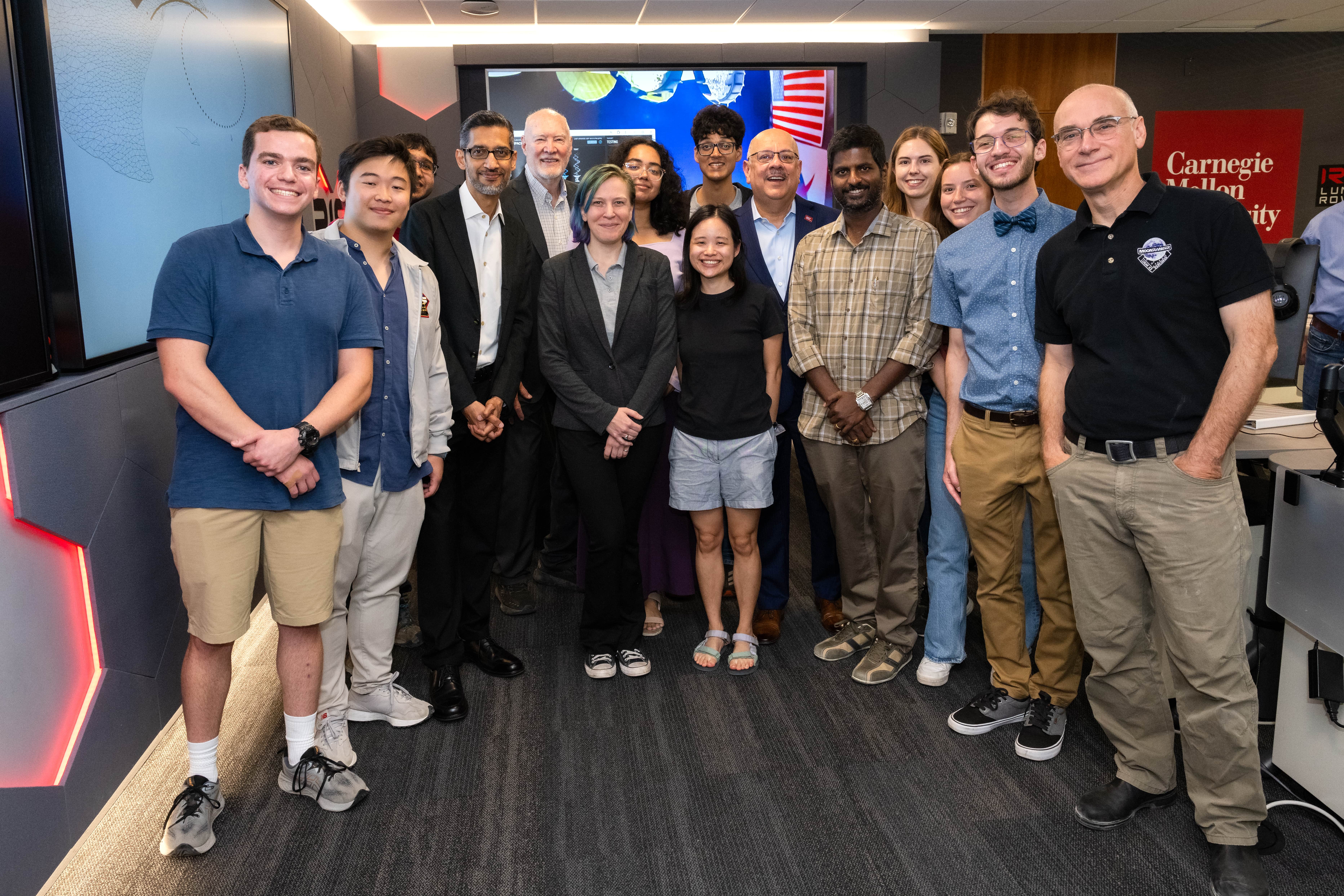 Pichai poses with Jahanian, Whittaker and other faculty, students and staff in Carnegie Mellon Mission Control.