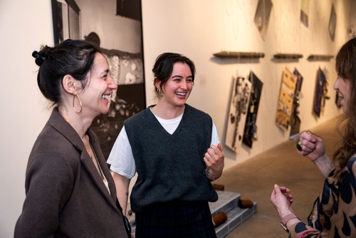 The opening reception of the School of Art MFA Class of 2025 thesis exhibition, "Holding Still, Holding On" in March 2025 at The Warhol.