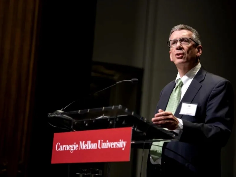 Provost Jim Garrett gives a speech at a podium.