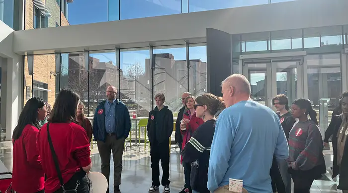 A group of people touring Tepper Quad. 