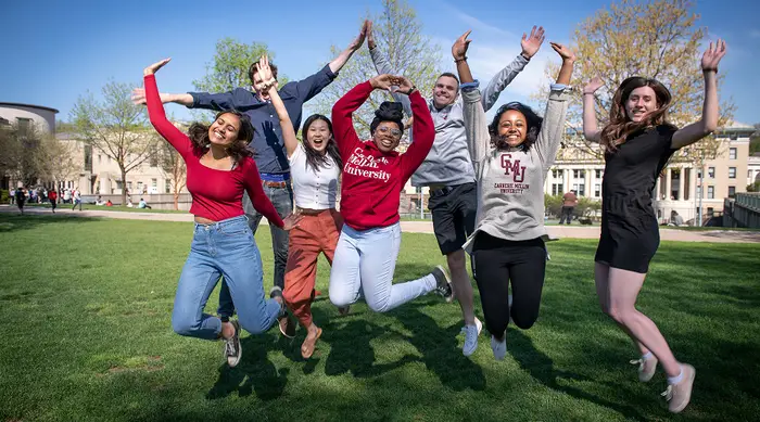 A group of CMU students jumping.