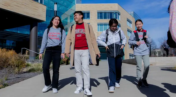 A group of CMU students walking outside.